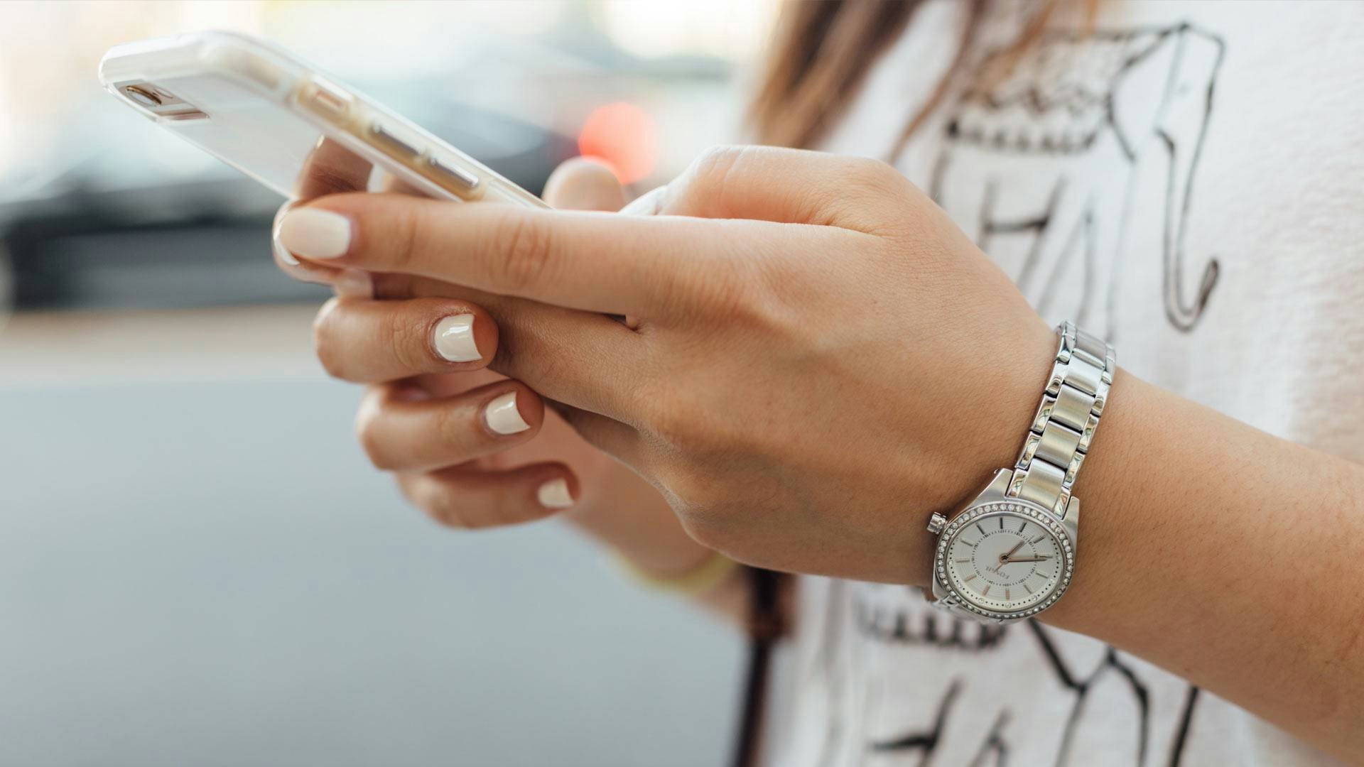 Woman Holding a Smartphone